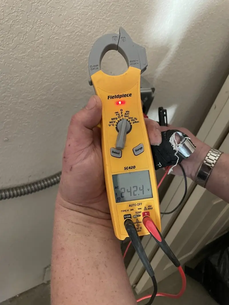 Voltage testing with clamp meter during Generator Installation in West Brunswick